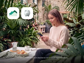A woman uses her smartphone while seated in a garden patio setting next to a coffee pot and fruit, with investment app icons floating above.